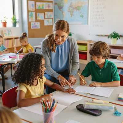 Teacher helping students learn