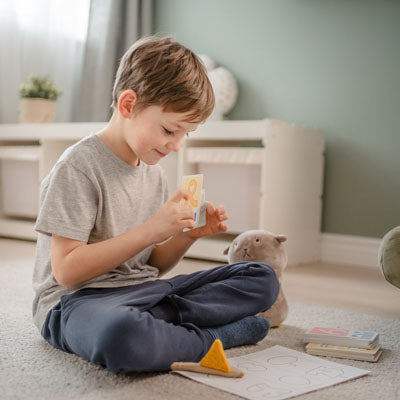 pic boy playing on carpet