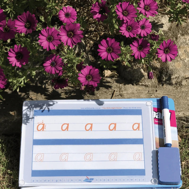 Our NSW Kindergarten Handwriting Kit sitting on it storage tin that turns into a lap table